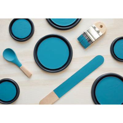 paint lids, small paint brush, wooded spoons and rounded sticks painted in Aegean Sea