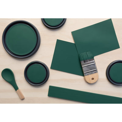  flatlay with paint lids, small paint brush, wooden spoons and stir stick painted in Earhart Emerald